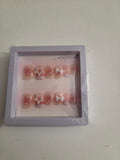 Hearts and butterflies press-on nail set - sheer pink with red hearts and pearl star charm