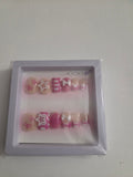 Pink glitter stars and bow press-on nail set with silver glitter and 3D white bow