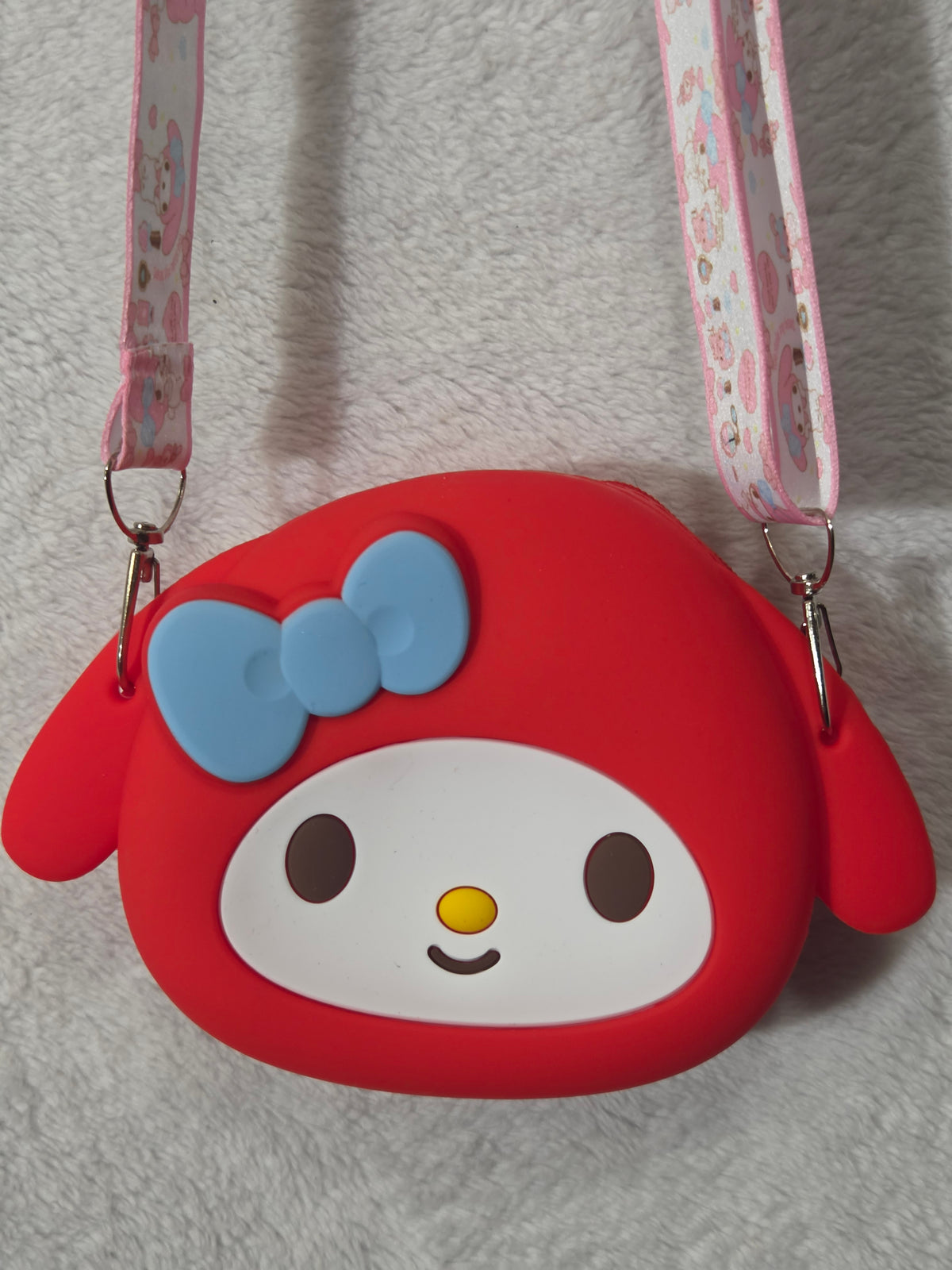My Melody-inspired red silicone crossbody bag full view with pink Sanrio-print strap at full length