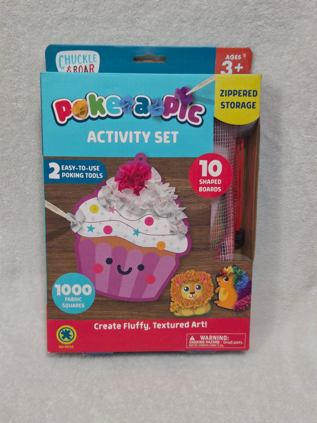 Chuckle & Roar Poke-a-Pic Activity Set front showing cupcake artboard and included contents