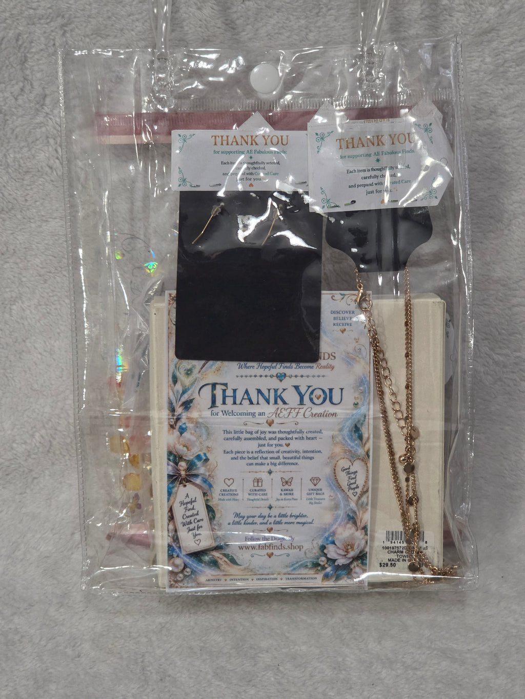 Jewelry Gift Bag — flat lay of packed bag showing AEFF thank you card and Macy's bracelet box