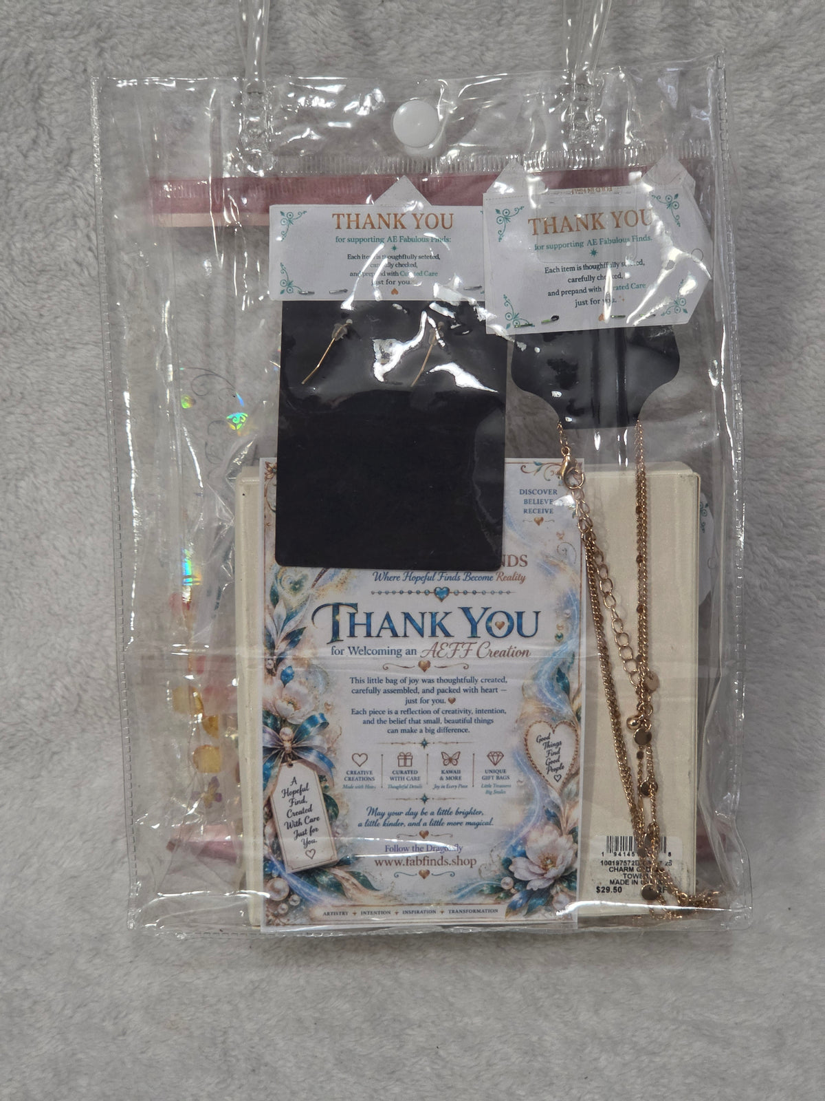 Jewelry Gift Bag — flat lay of packed bag showing AEFF thank you card and Macy's bracelet box