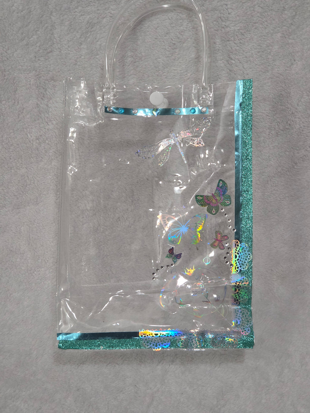 Kawaii Gift Bag Cinnamoroll Dreams — front of assembled bag with teal glitter trim, rhinestone dragonfly and holographic butterflies