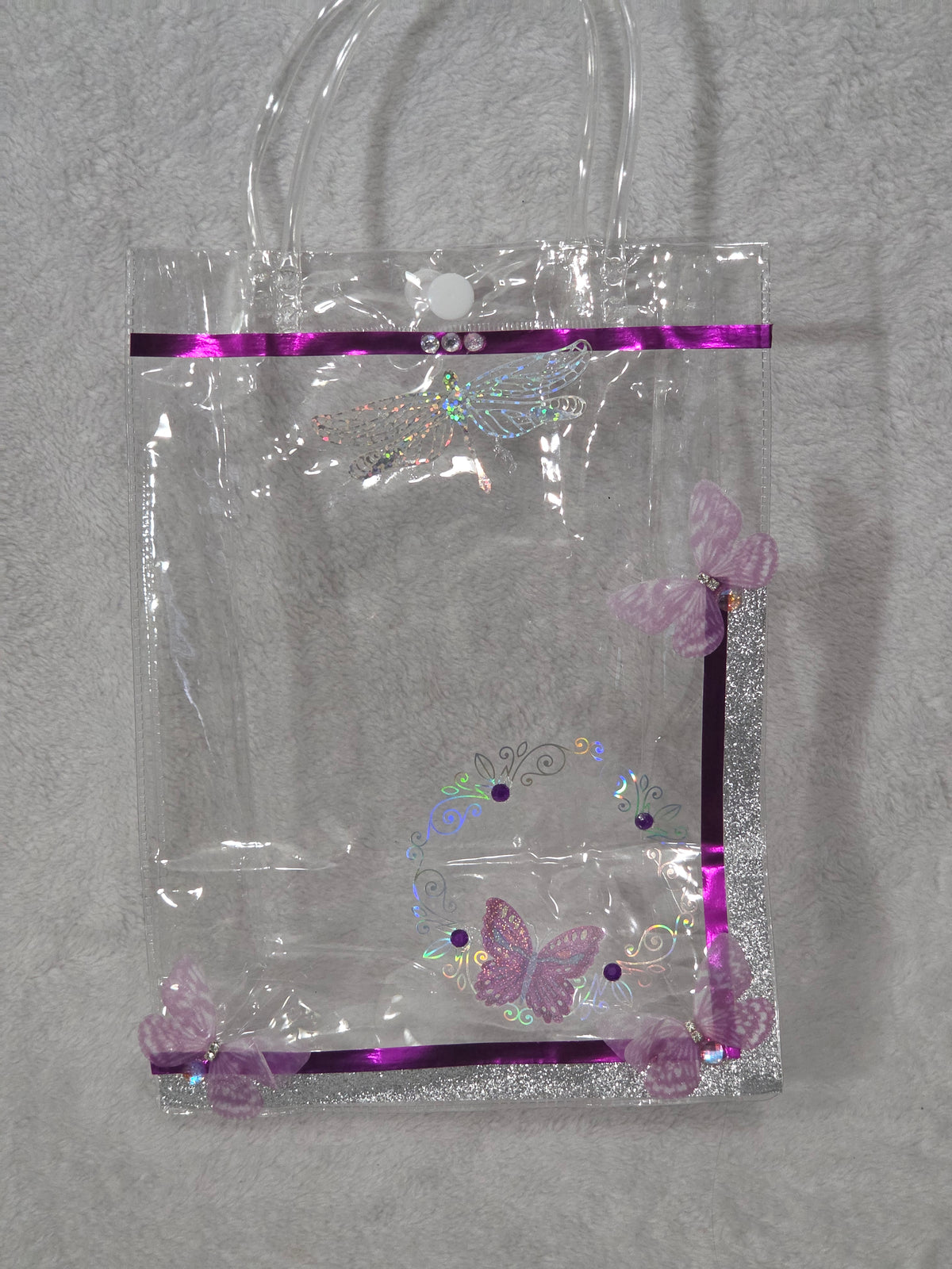 Kuromi Dark Magic — empty clear PVC bag showing purple butterfly, holographic swirl pattern and 3D rose accents