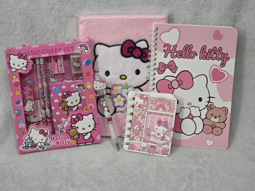 Hello Kitty Sweet Dreams — flat lay of all contents including spiral notebook, fuzzy journal, stationery set and charm pen