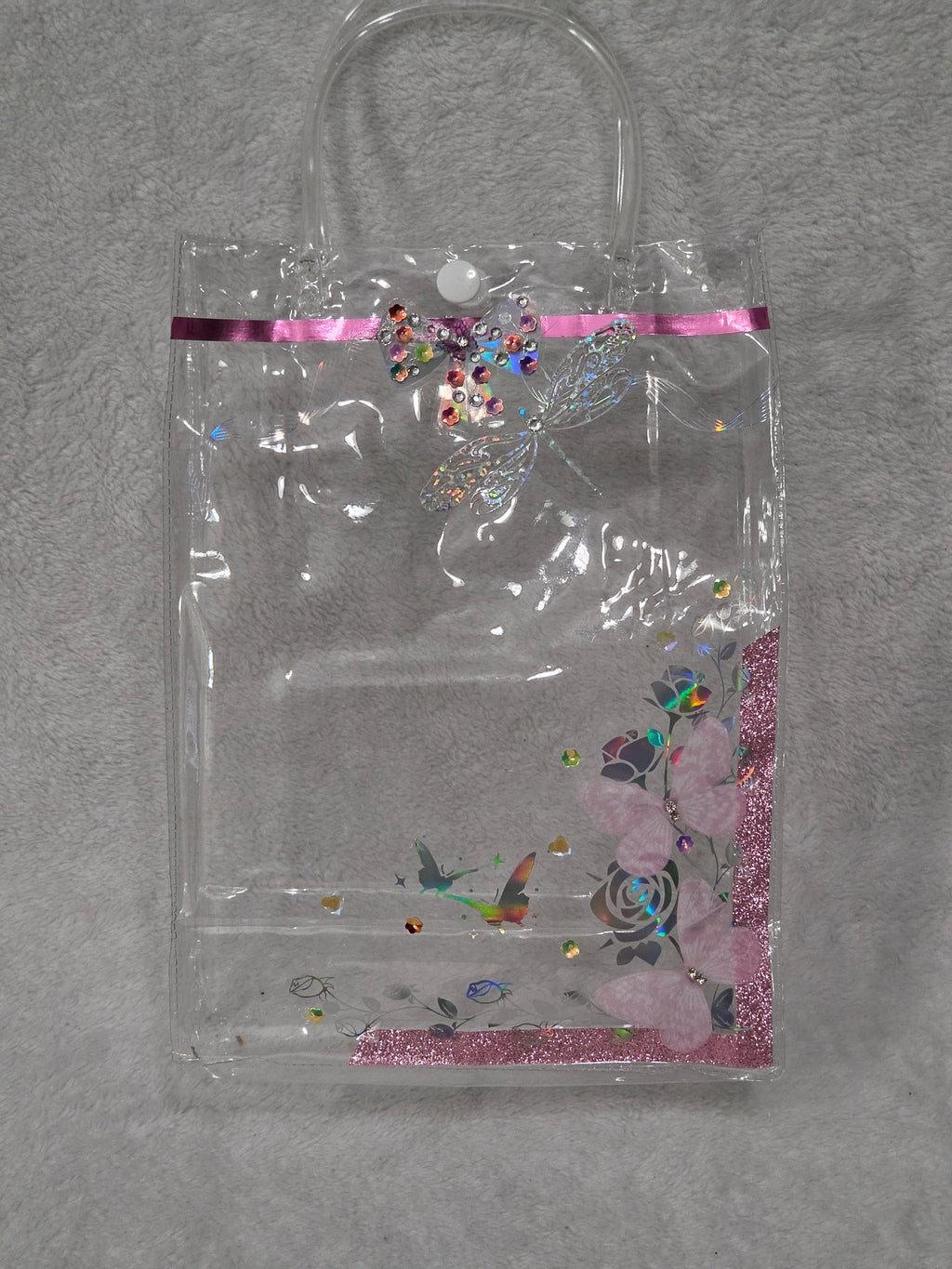 Empty AEFF pink glitter tote with holographic rose butterfly print, rhinestone dragonfly and 3D pink butterfly accents