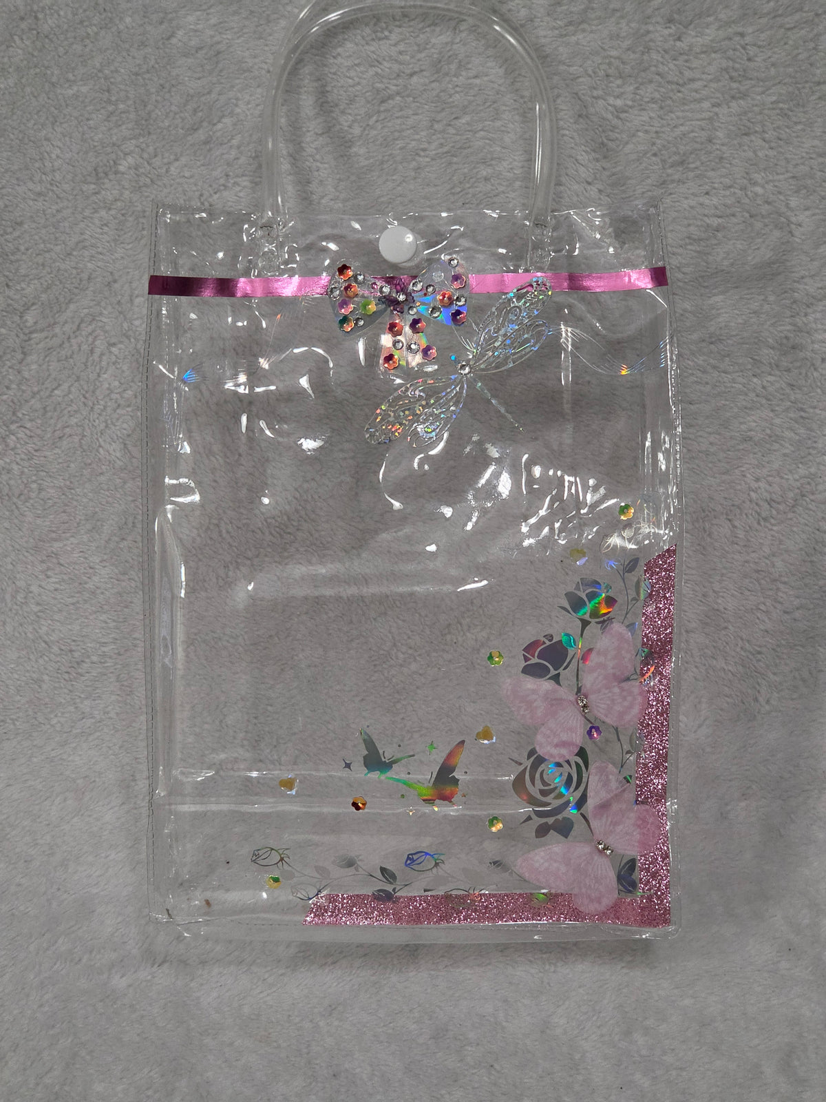 Empty AEFF pink glitter tote with holographic rose butterfly print, rhinestone dragonfly and 3D pink butterfly accents