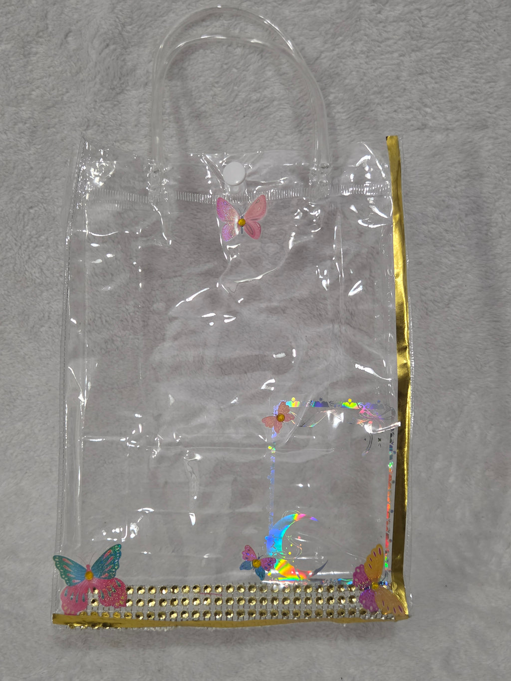 Peach and Gold Glow — flat lay of all contents including Cherimoya peach lip oil trio, e.l.f. Power Grip Primer, e.l.f. sponge, Wunder2 Glitter Gelly, makeup wipes, hand sanitizer and gold hoop earrings