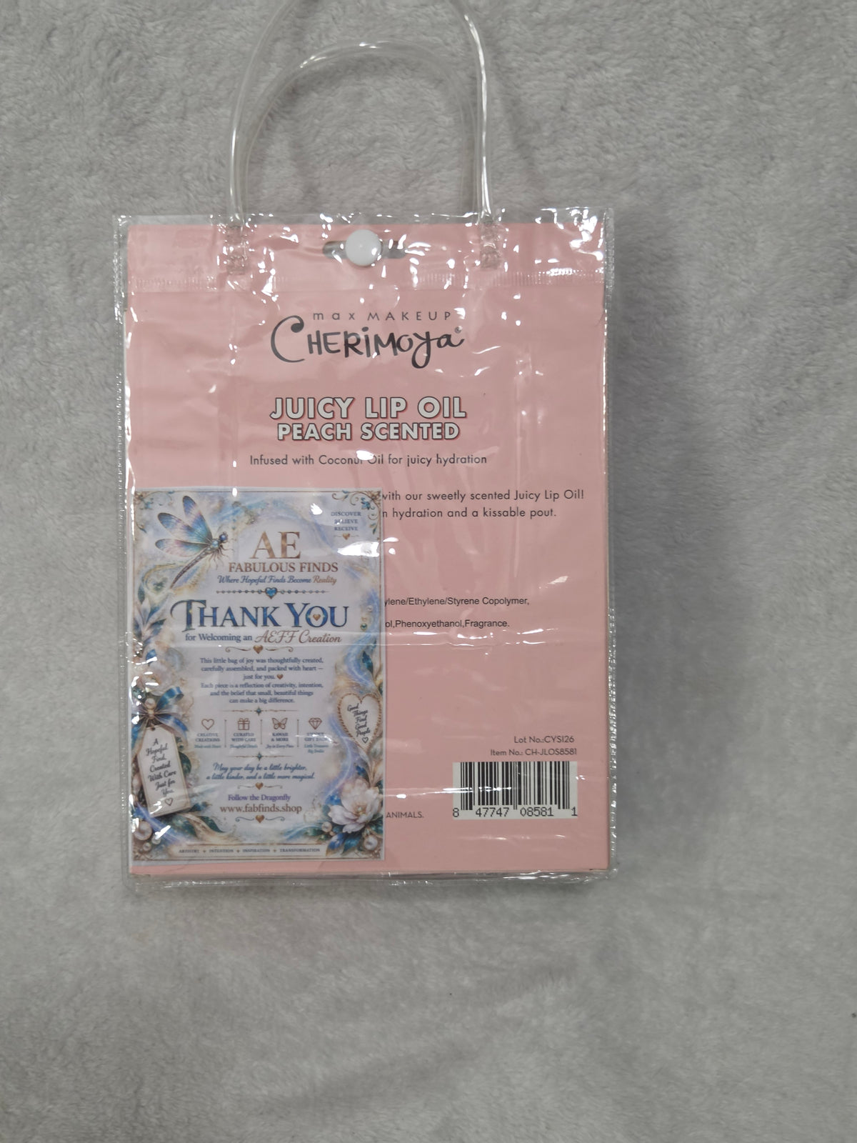 Beauty Bag Peach and Gold Glow — back of sealed bag showing AEFF dragonfly thank you card and Cherimoya box