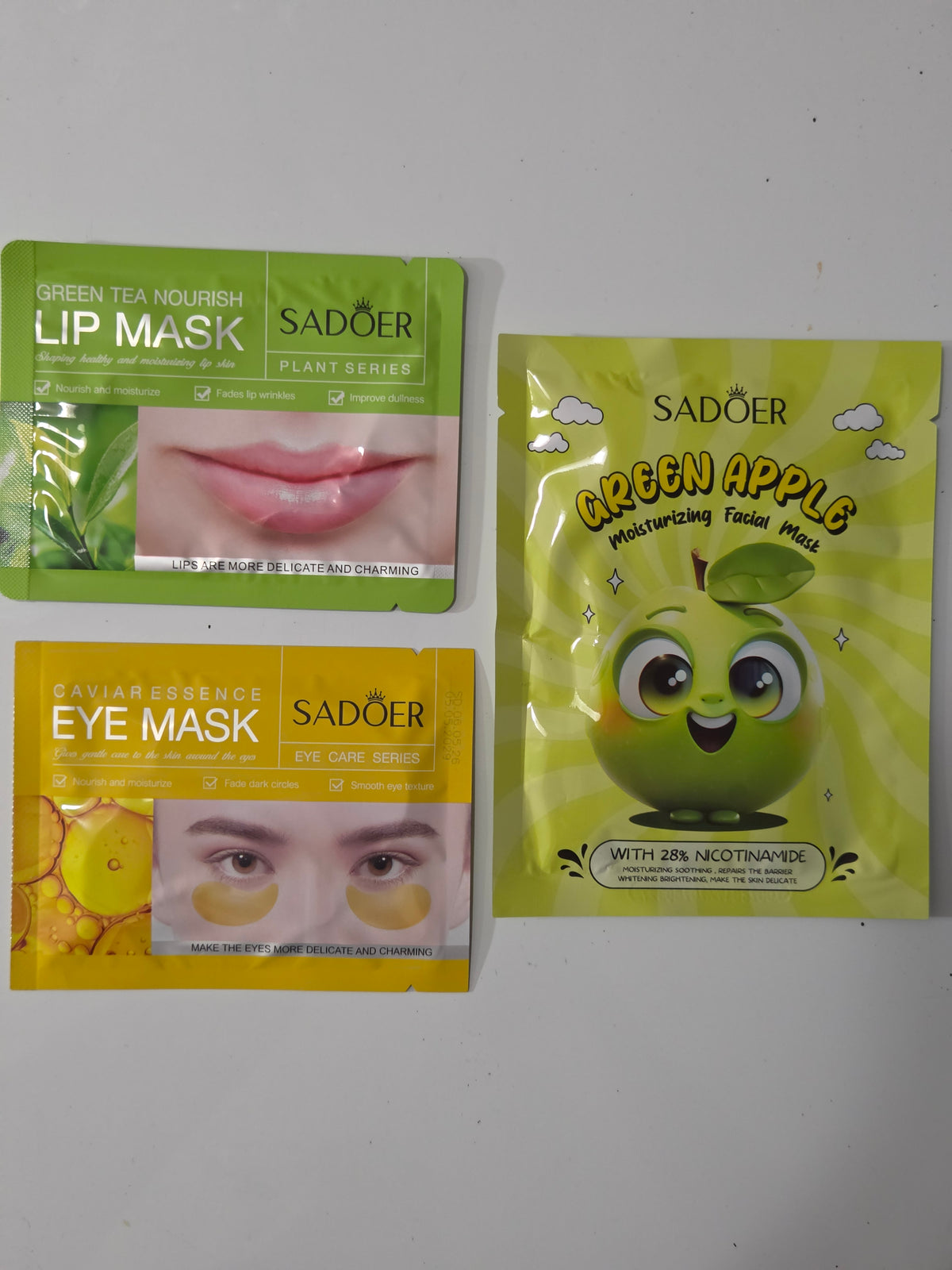 Green apple facial mask, green tea lip mask, and gold eye mask included in Dream Big mini spa bag