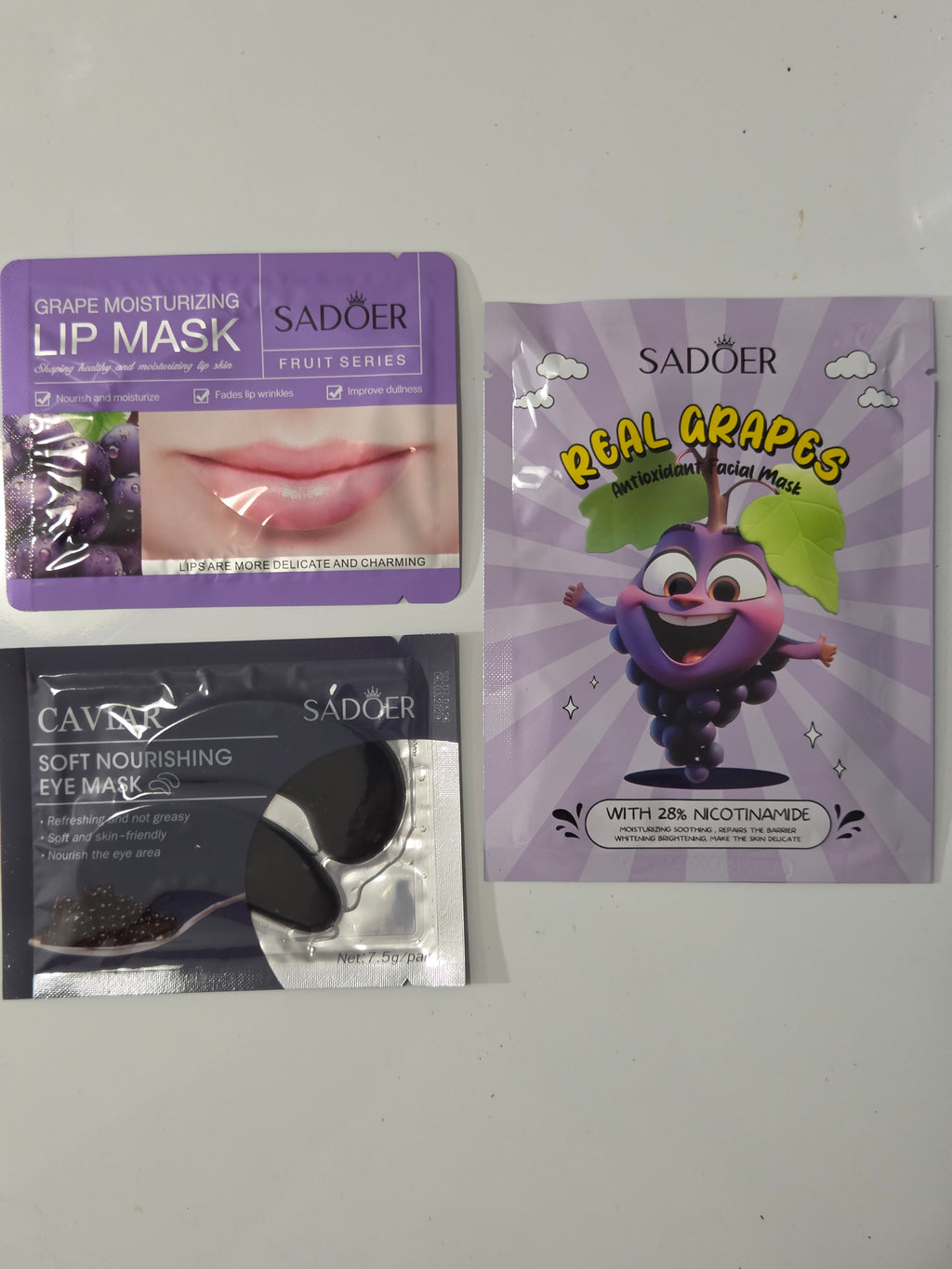 Grape facial mask, grape lip mask, and caviar eye mask in Change the World mini spa gift bag