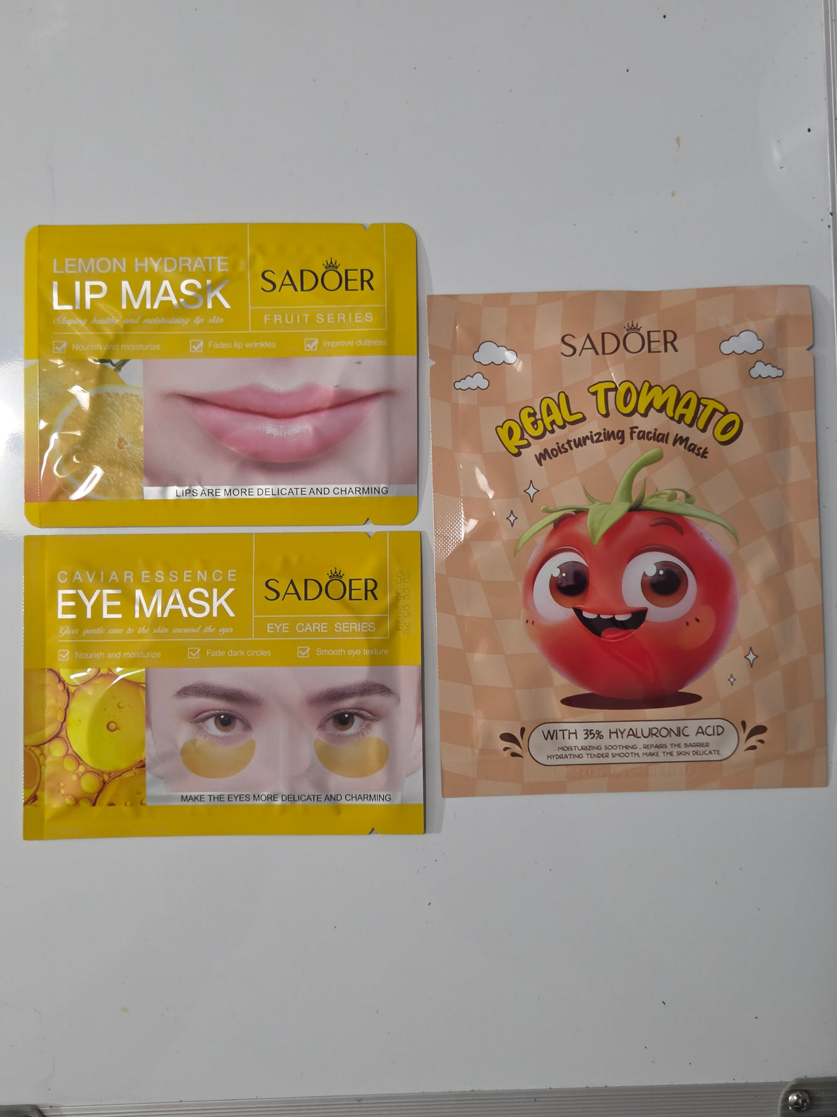 Tomato-themed facial mask, lemon lip mask, and caviar eye mask included in Create Happiness bag
