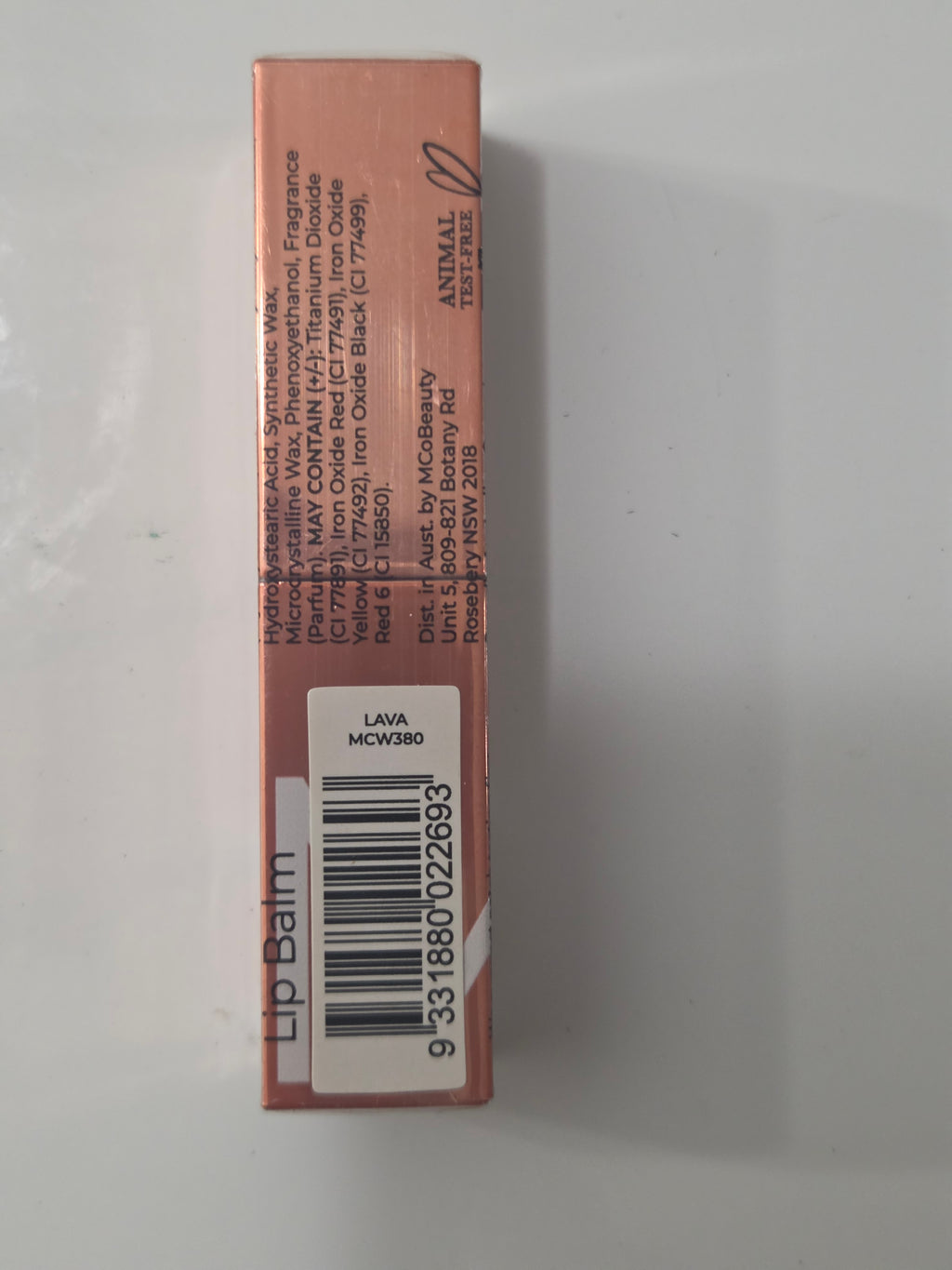 MCoBeauty Sheer Tint Lip Balm in Lava with cap on