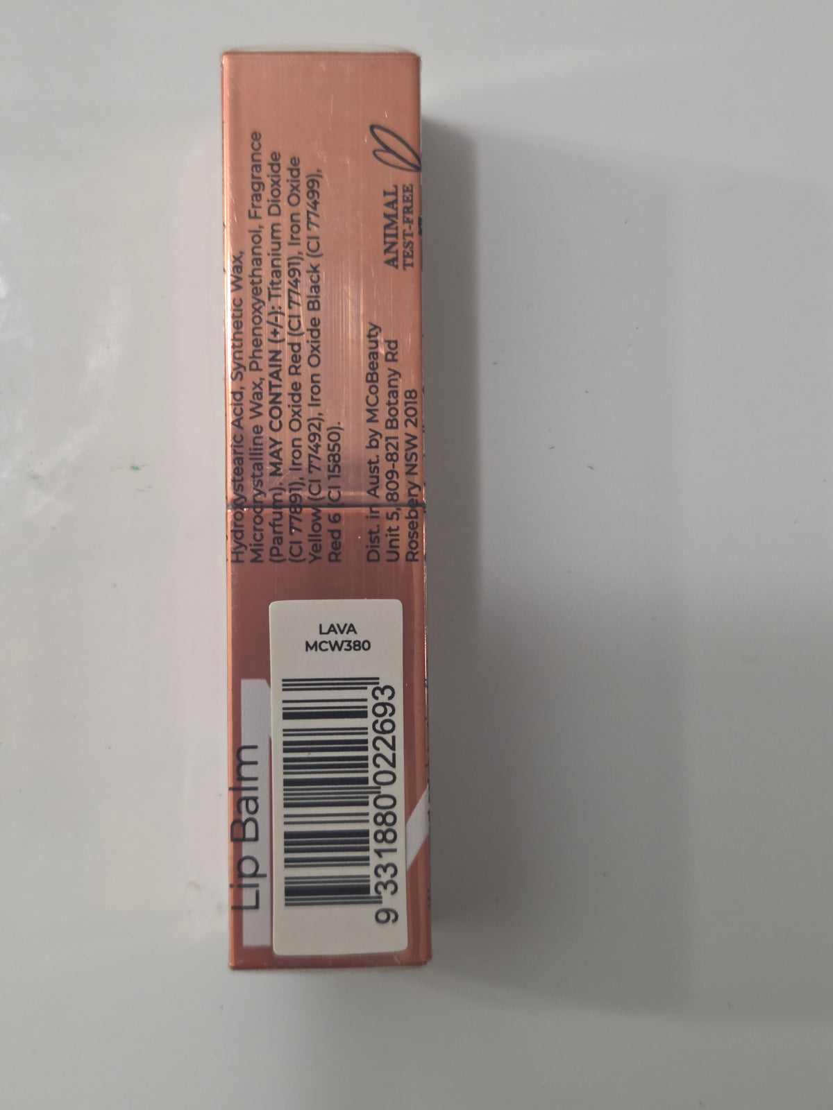 MCoBeauty Sheer Tint Lip Balm in Lava with cap on